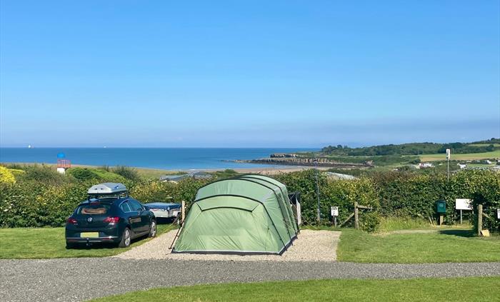 Stunning all-weather serviced pitches suitable for tents, touring caravans and motorhomes